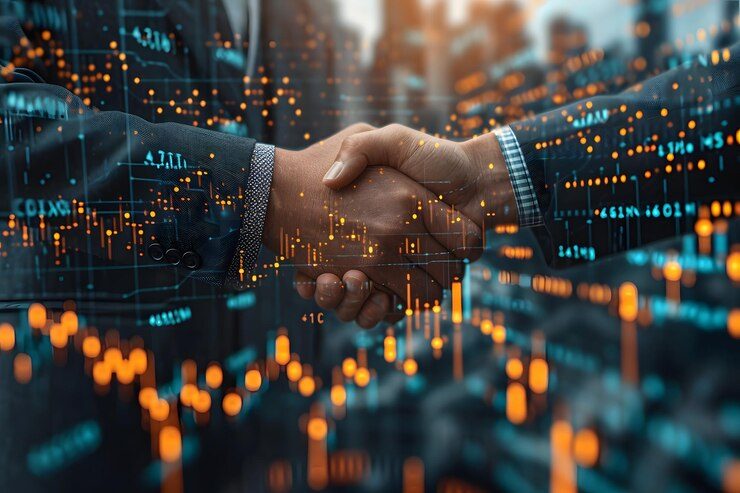 Dos manos estrechándose sobre un fondo de gráficos y datos financieros.